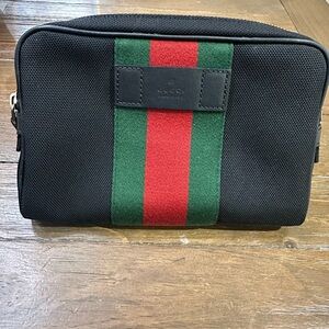 Gucci zip top waist bag
Silver tone hardware